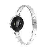 Silver smartwatch with a black screen on a white background